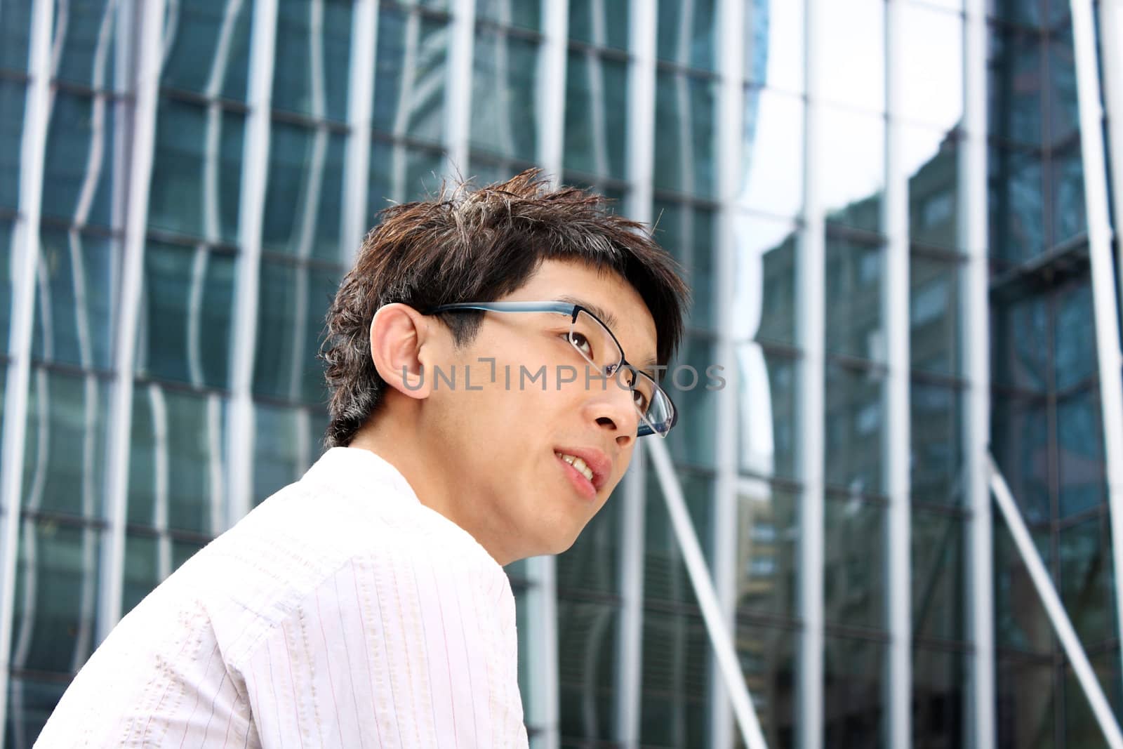 Portrait of asian happy young businessman smile.
