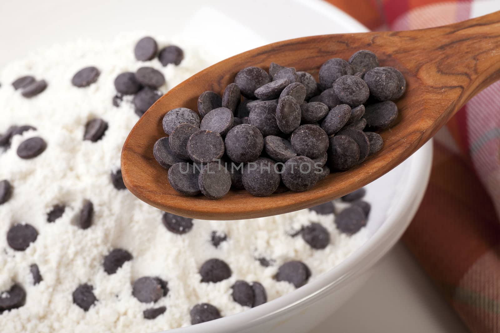 Adding the chocolate chips to the ingredient bowl.