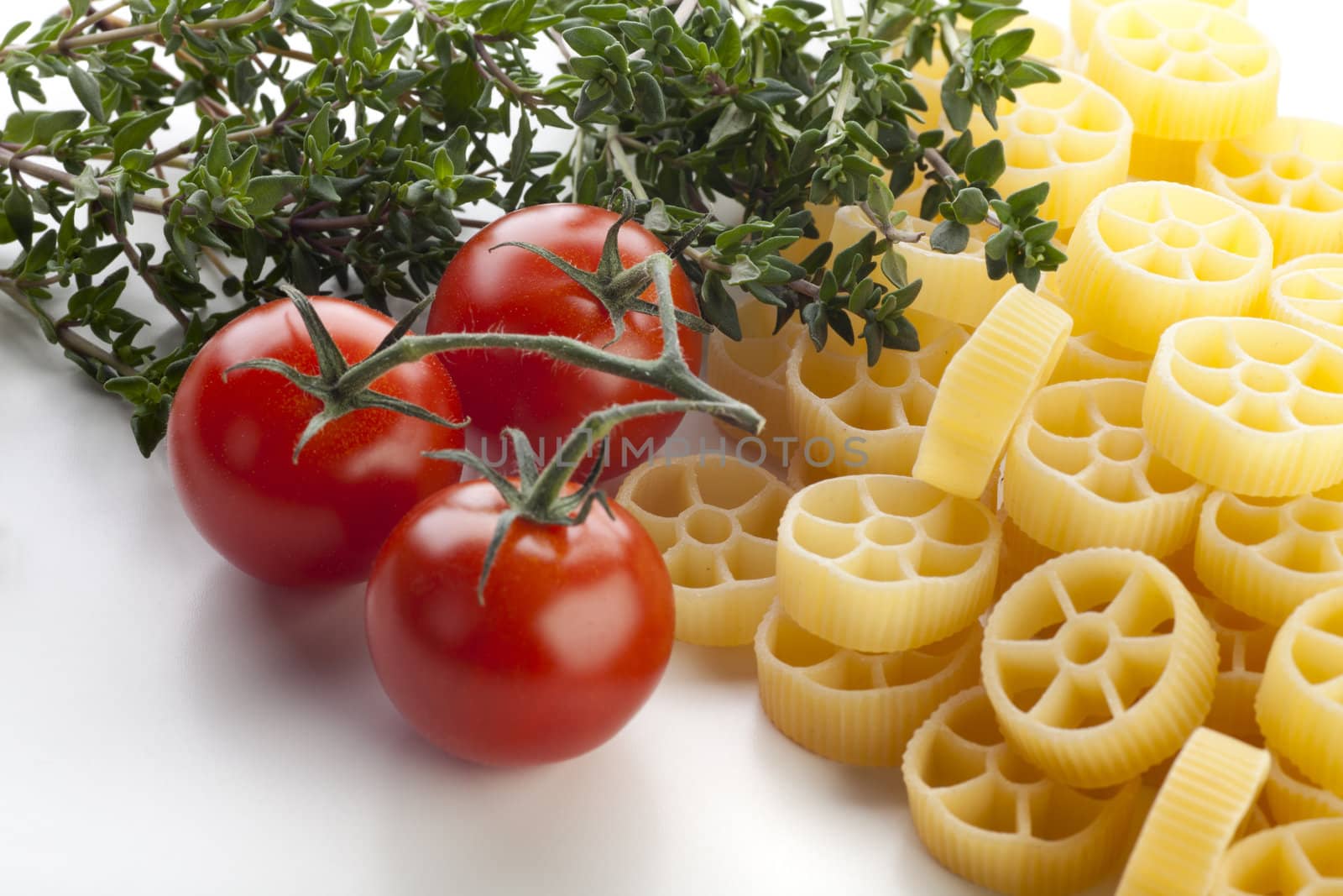 Dried rotelle pasta, cherry tomatoes and thyme.