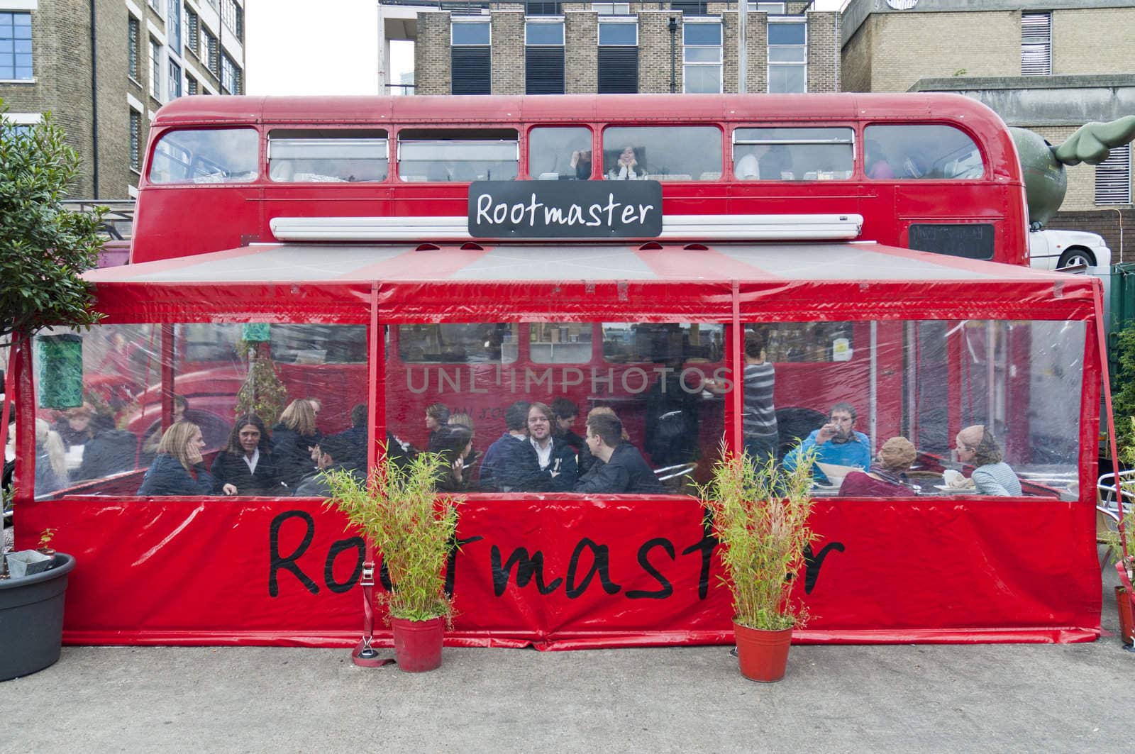 LONDON - OCTOBER 17: Restaurant built inside old double decker routemaster busin Bricklane market, which takes place every Sunday. October 17, 2010 in London, England.