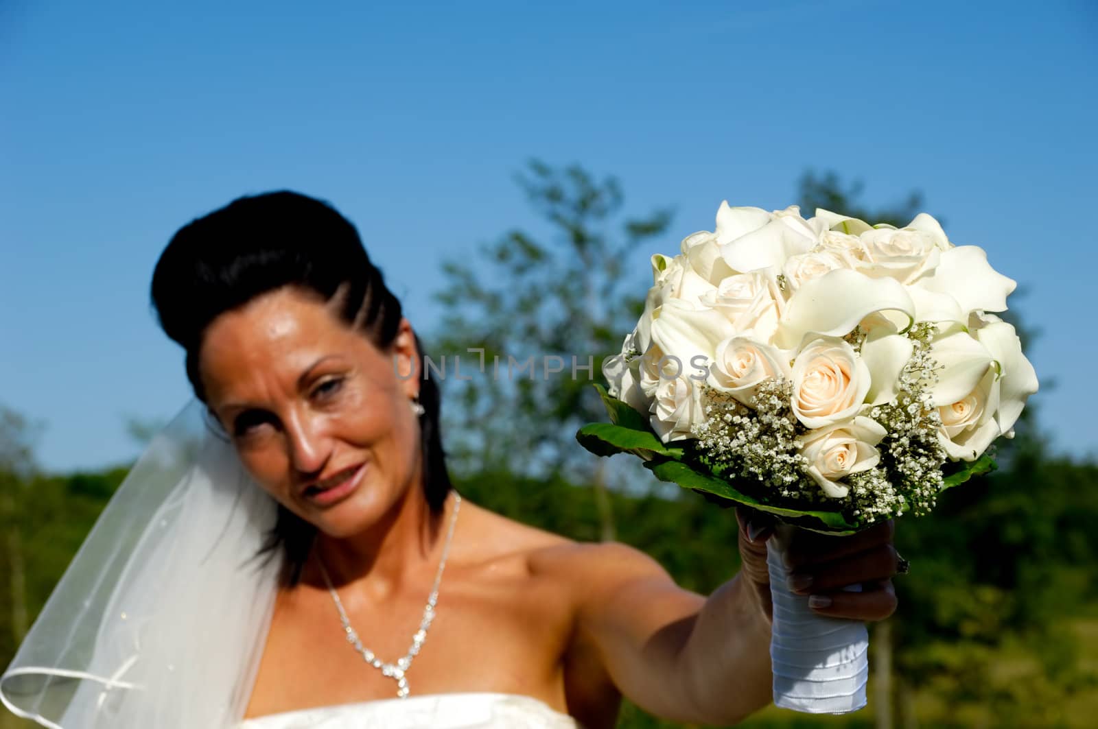 Bride with flower bouquet by cfoto