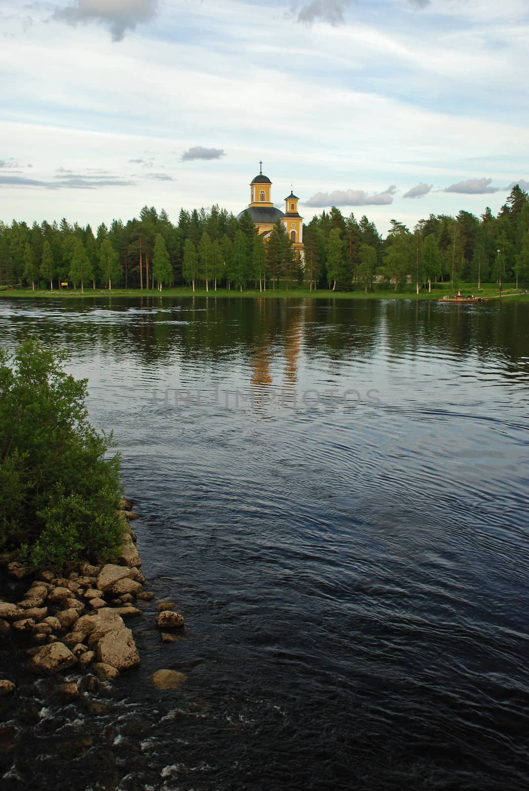 Church and park of Kuhmo in the border of lake  by dariya64