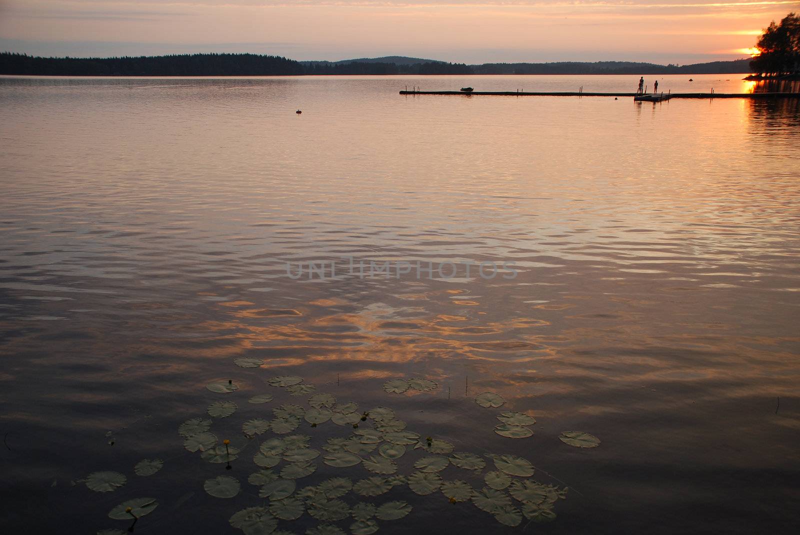 Sunset at beutiful lake Kuuhankavesi in Central Finland by dariya64
