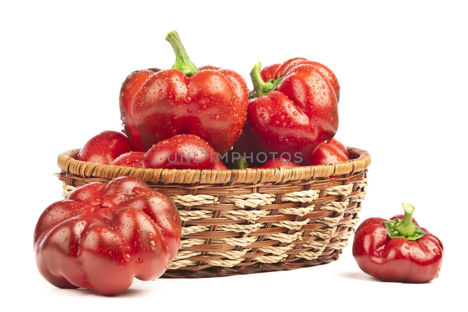 Red pepper in basket on white background