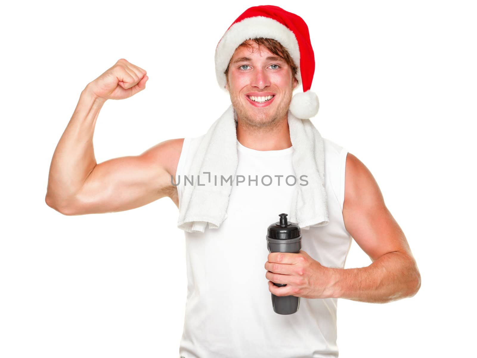 Christmas fitness man showing bicep muscles fit for holidays. Handsome male in his 20s wearing santa hat isolated on white background.