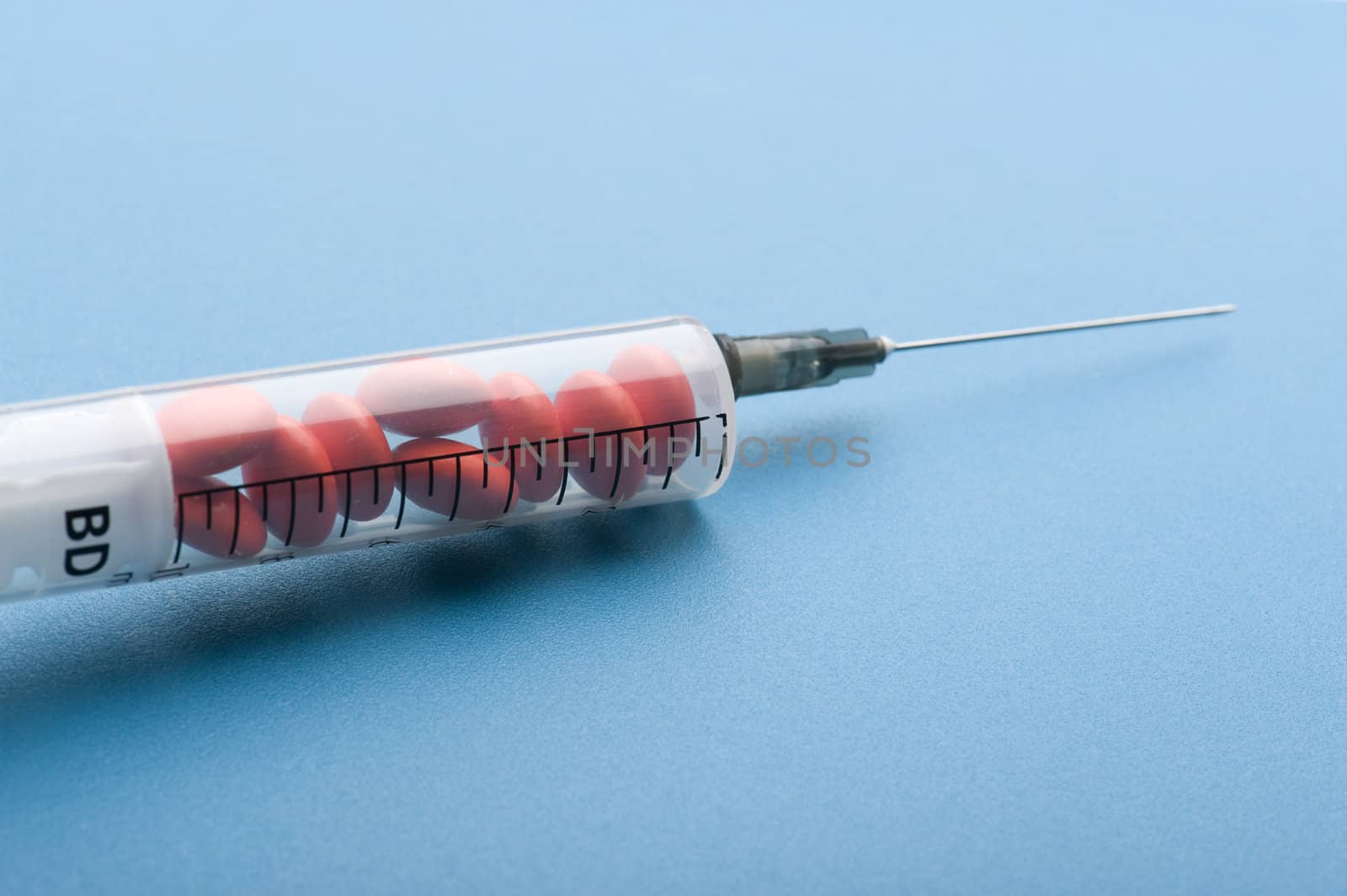 object on blue - medical Tablet and syringe