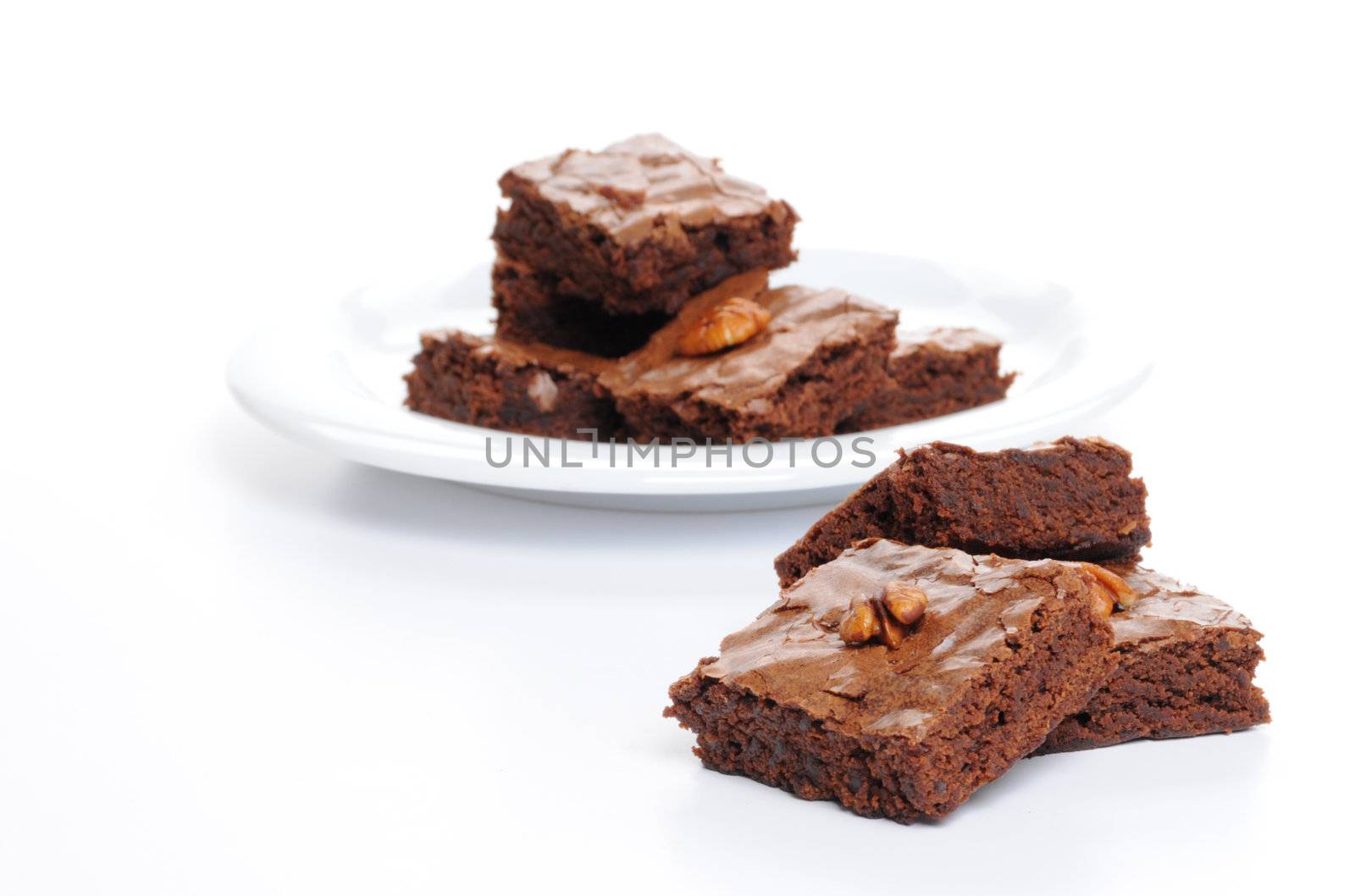 Fresh baked brownies shot on a white background.