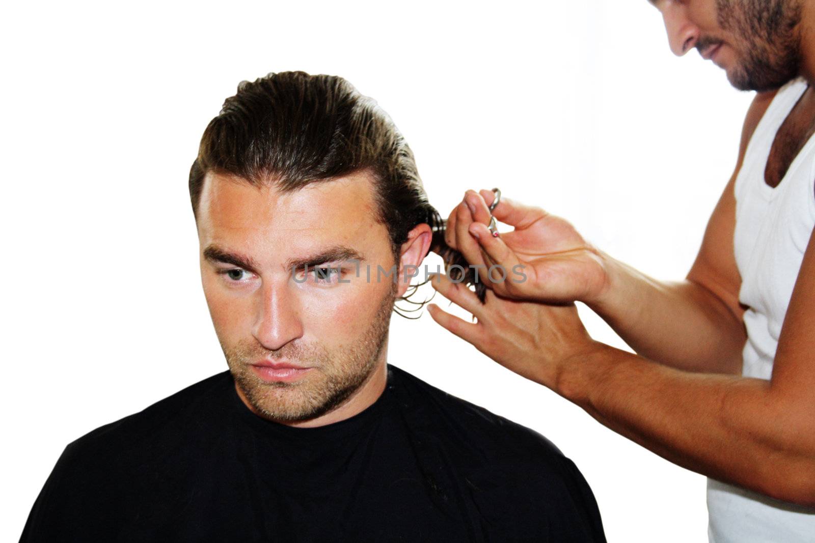 Master hairdresser cuts a customer's hair