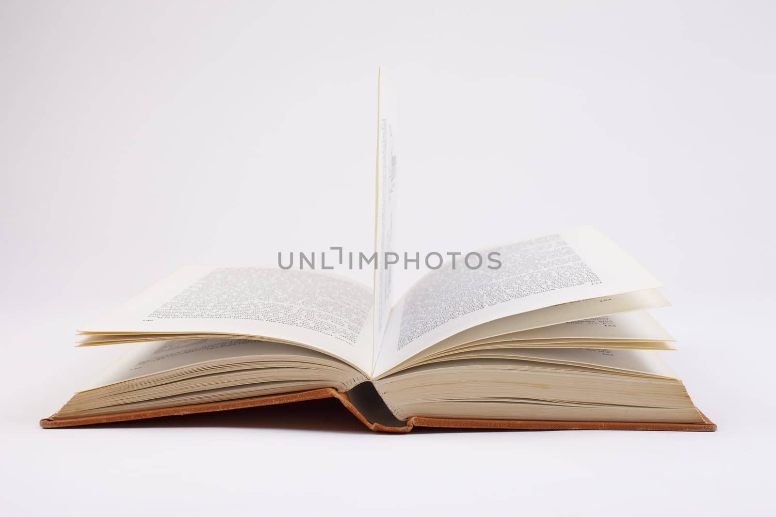 An open book on a white background.