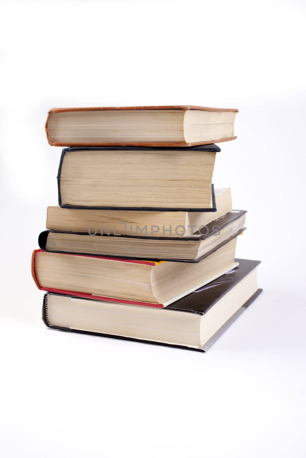 A pile of books on a white background.