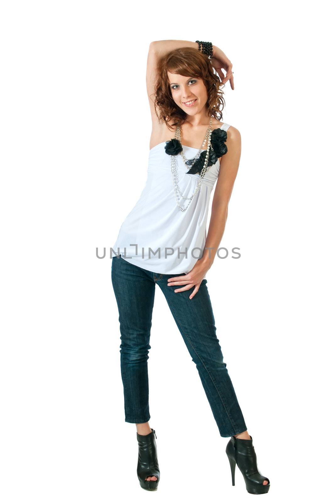 Pretty brunette woman standing in high-heels against a white background