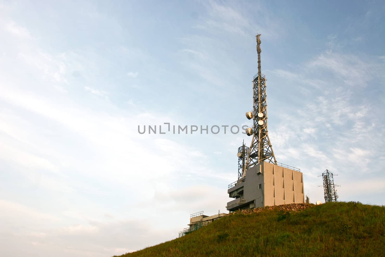 Transmitting station in a peak under blue sky