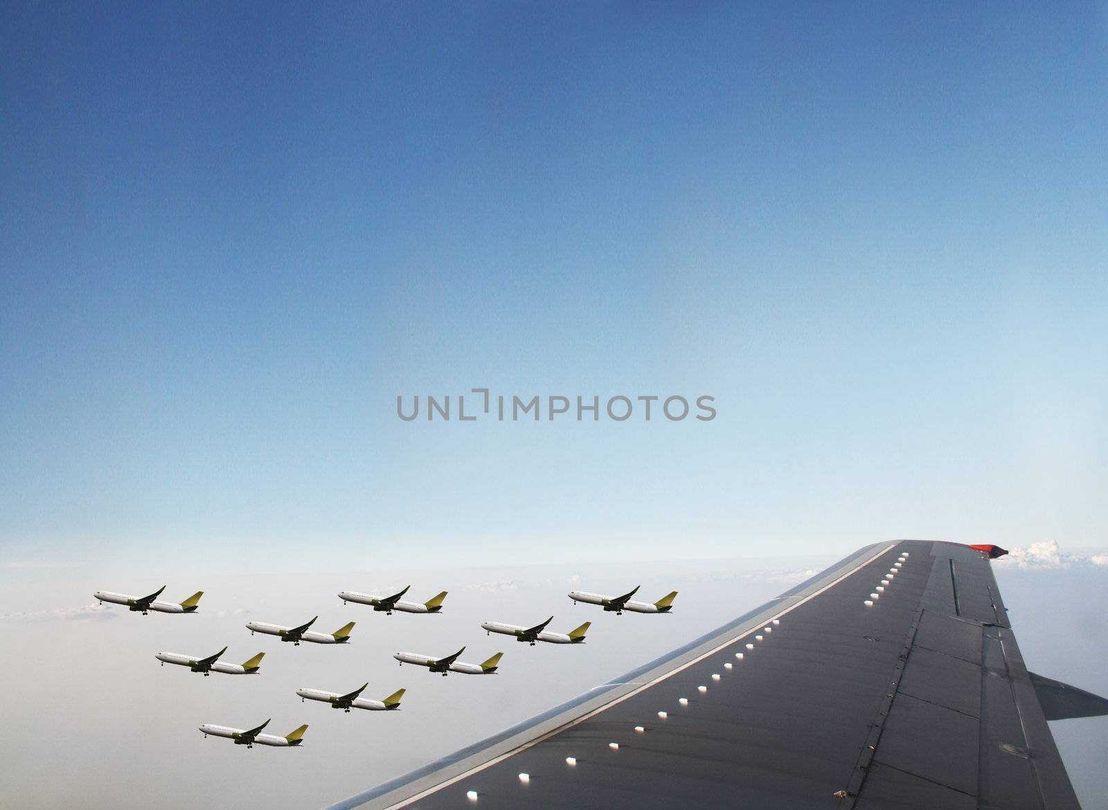 Aircraft in flight over the blue clouds 