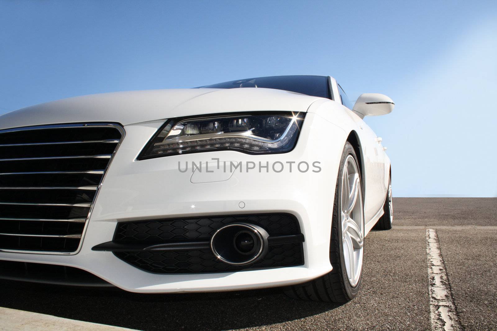 white sports car on a colorful background