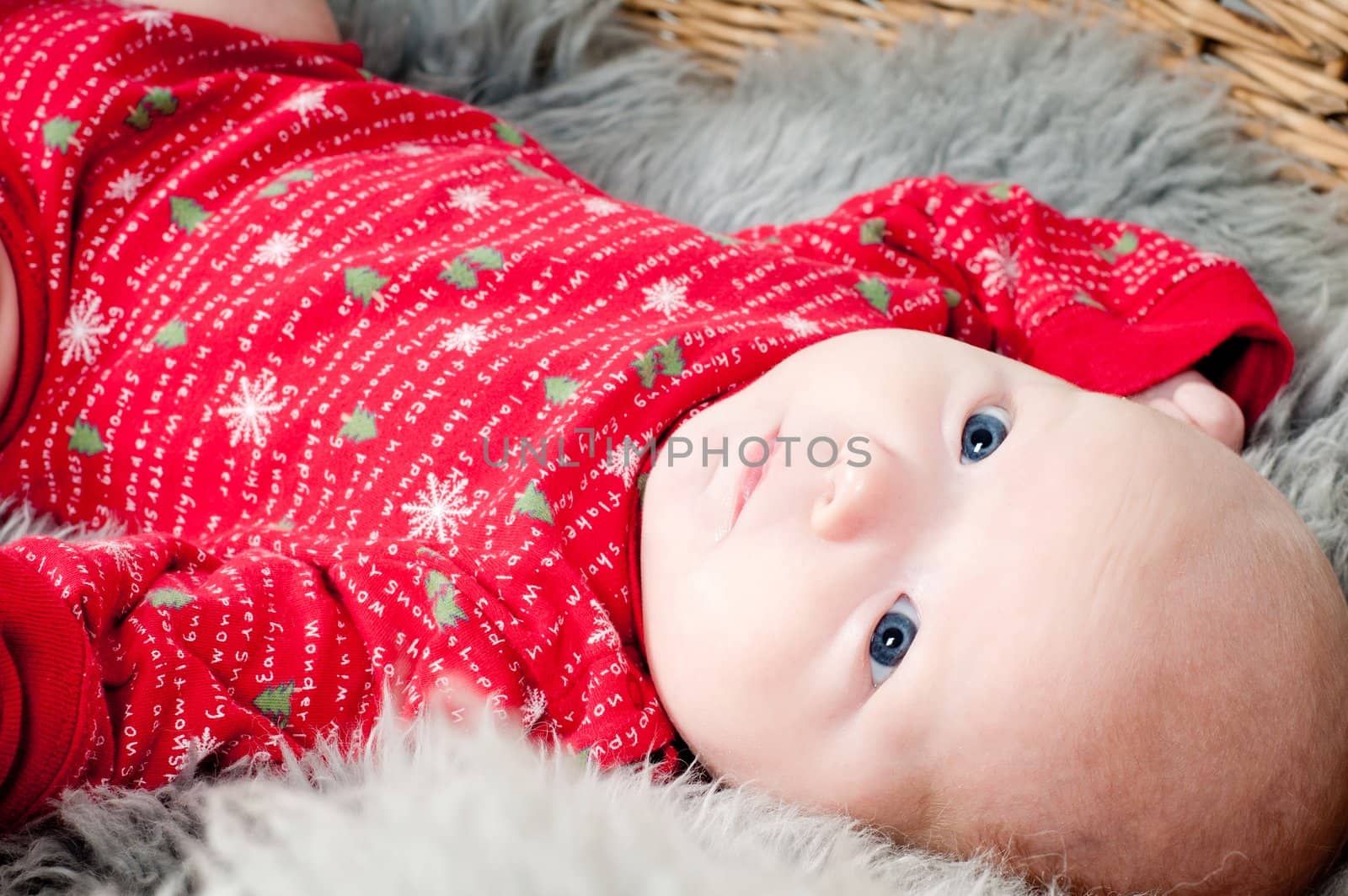 Shot of little cute baby in red