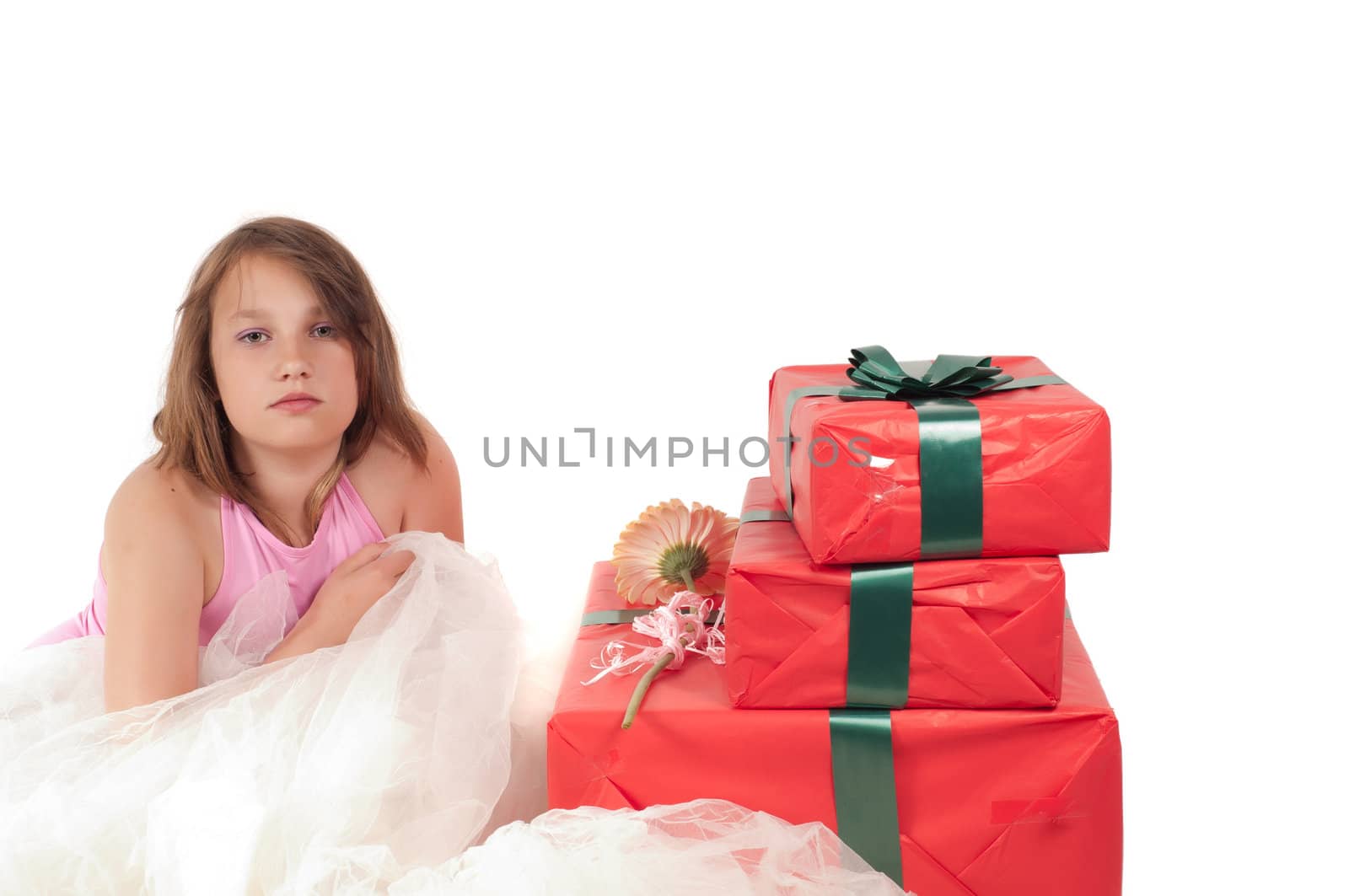 Teenager girl with presents in studio isolated on white