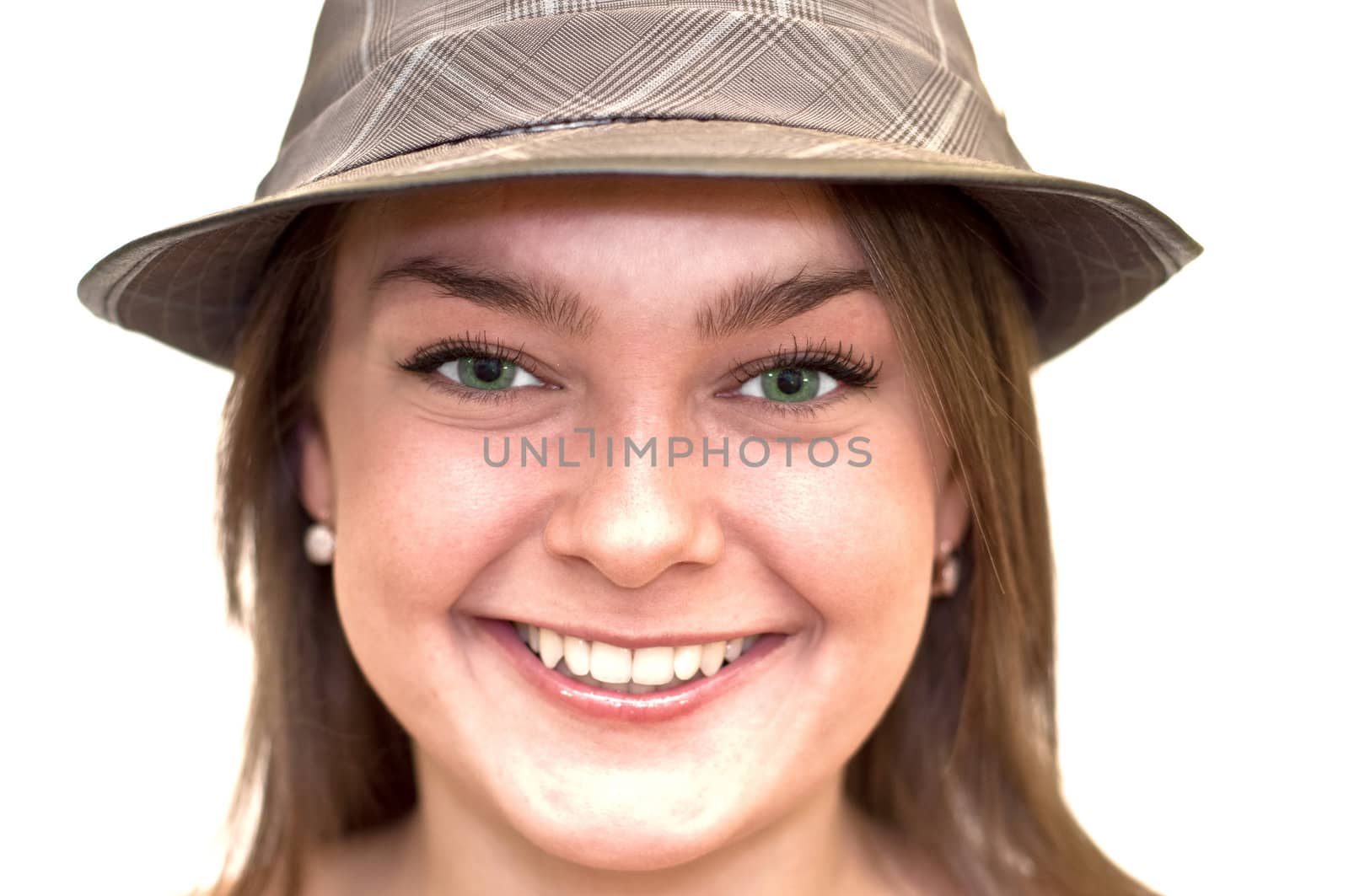 Beautiful young woman with green eyes wearing a hat. Close-up, portrait. Isolated on a white background.