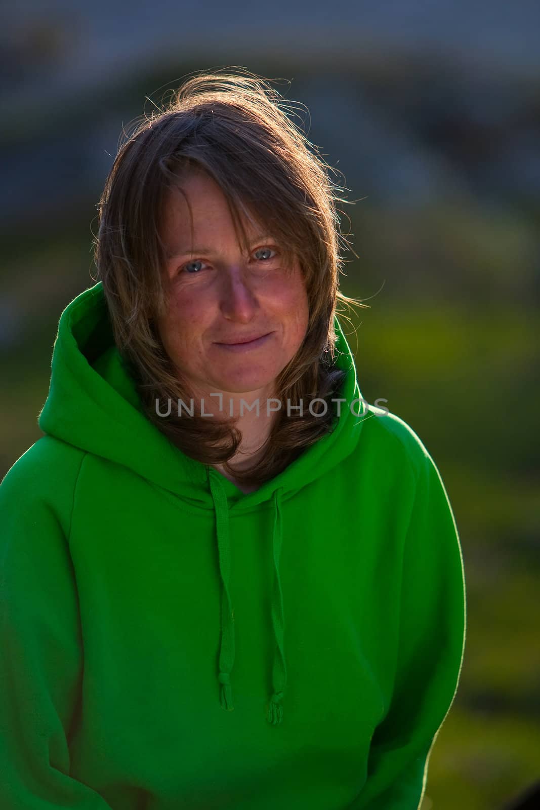 Portrait of young woman on the open air