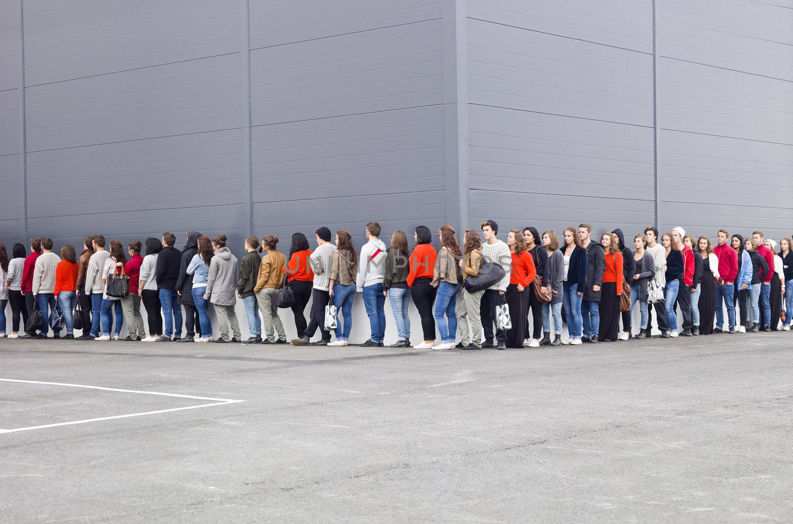 Large group of people waiting in line