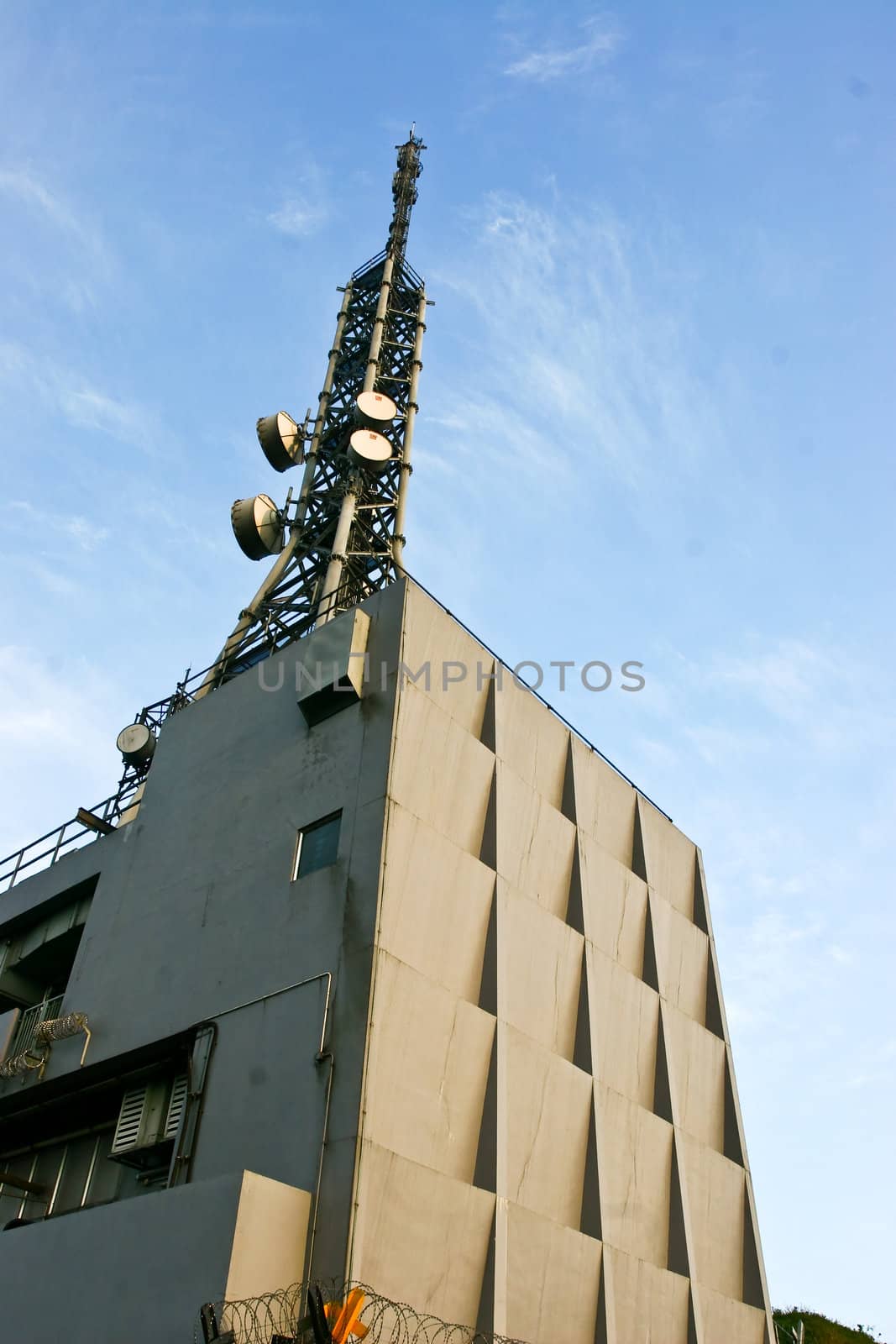 Transmitting station in a peak under blue sky
