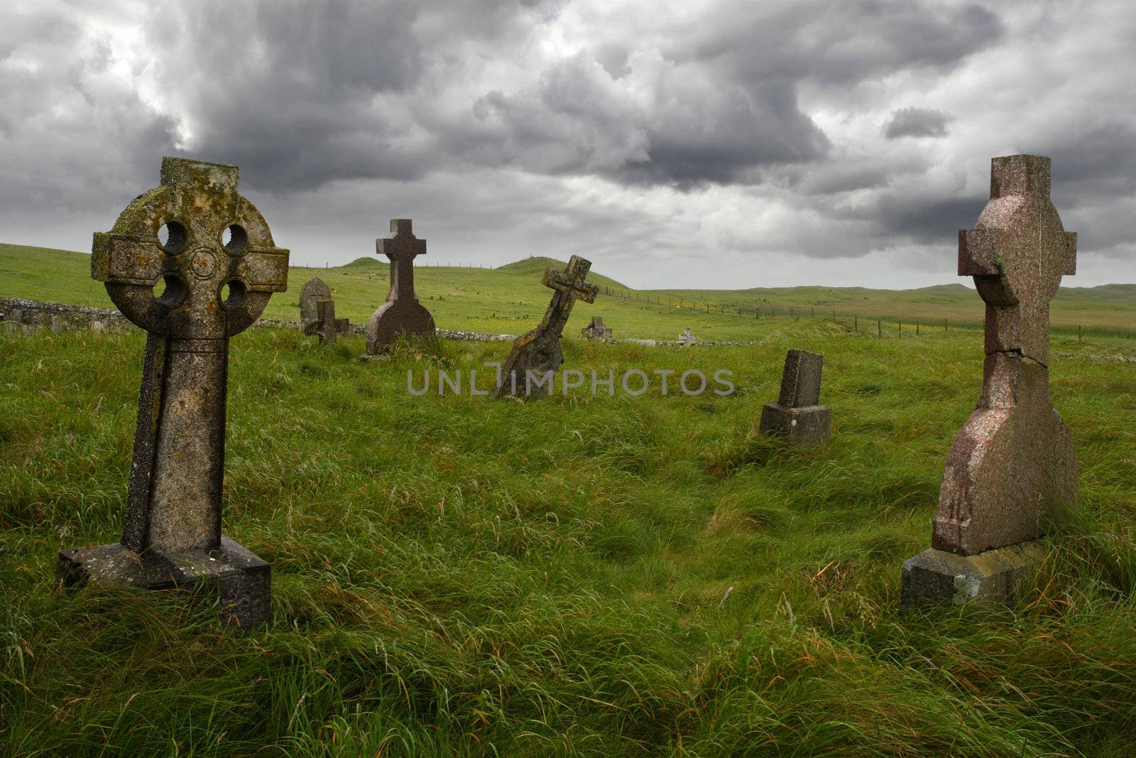 Ancient Celtic gravesite with unmarked gravestones from the 1600's in the middle of a meadow in rural Scotland.
