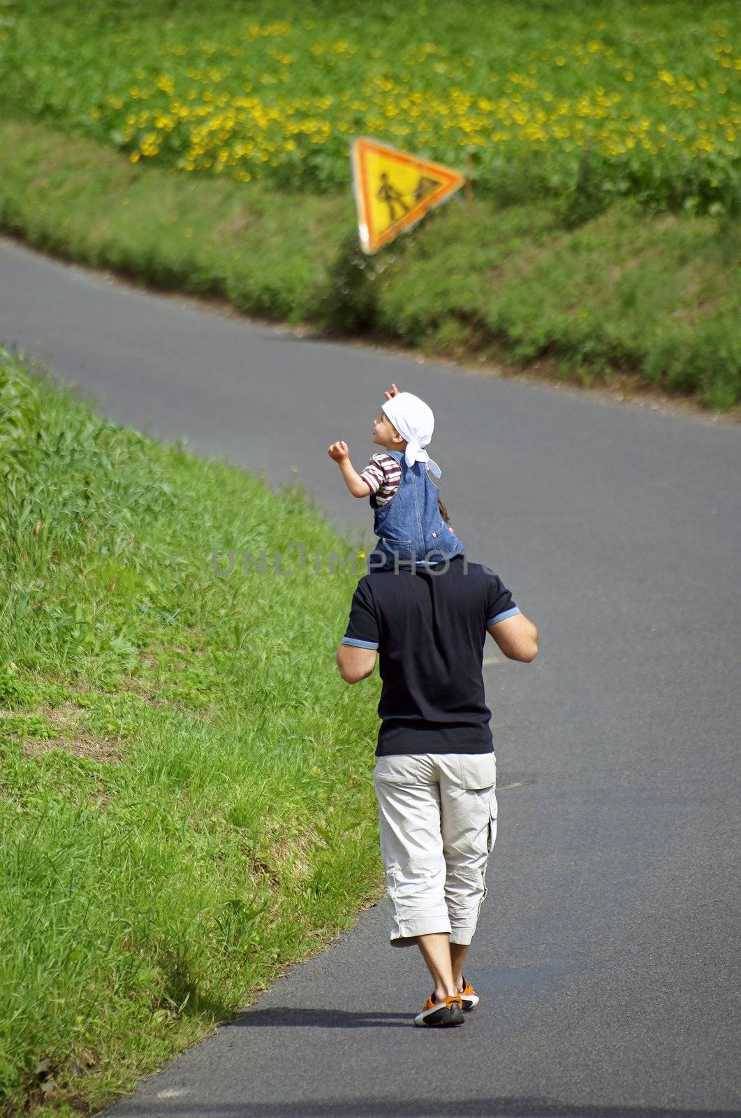Father and son walking  by wvantveer