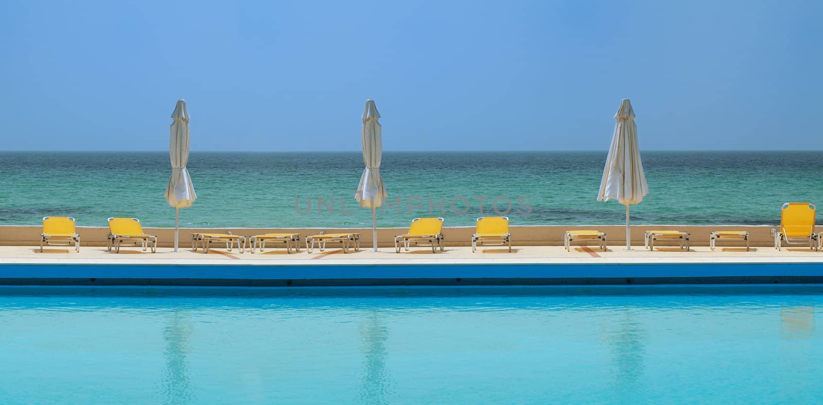 sunny day on a swimming pool, beach view background 