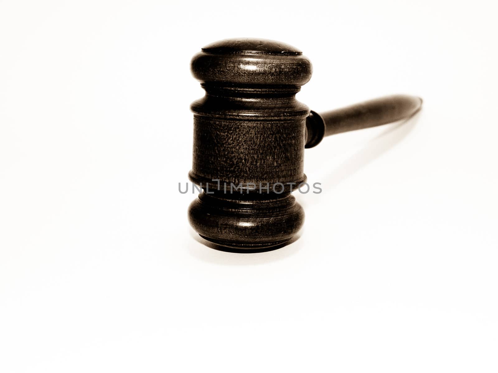 Gavel in sepia on white by chaosmediamgt