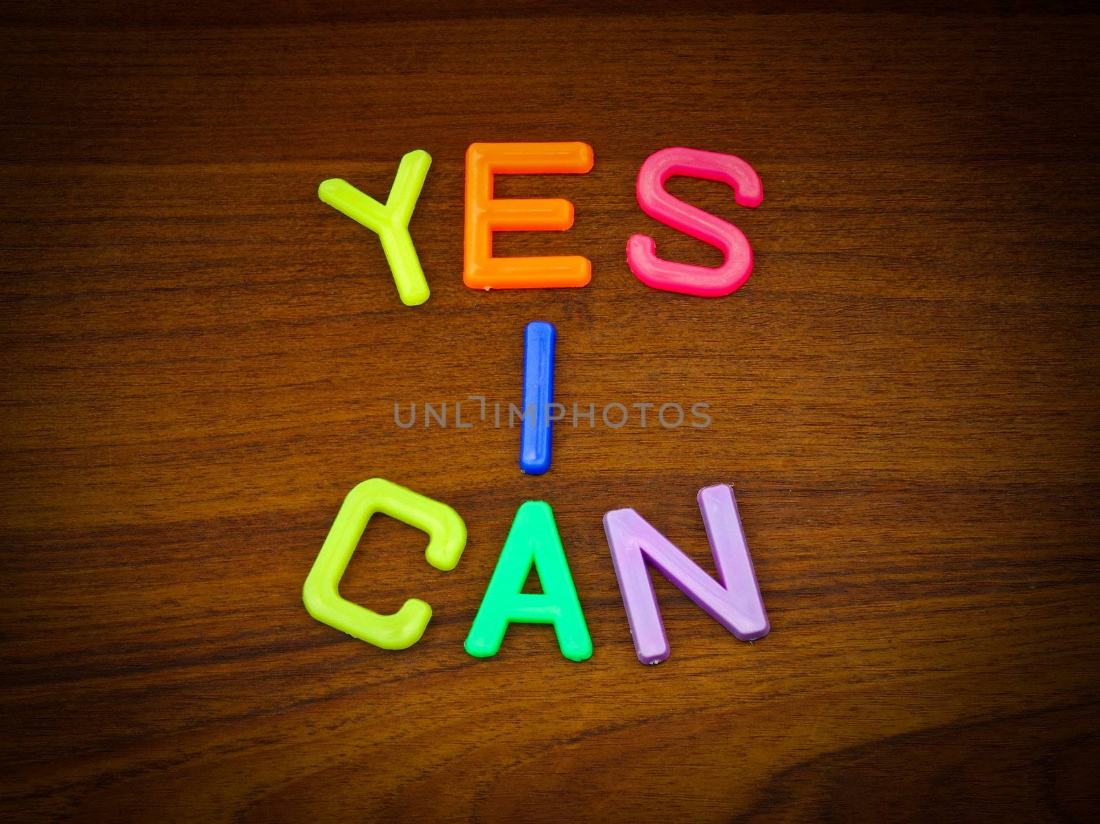 Yes I can in colorful toy letters on wood background  by nuchylee