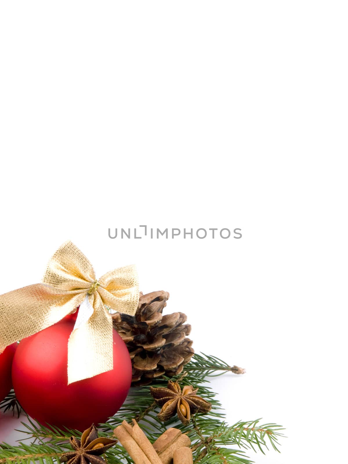 Picture of red glass ball and fresh spruce on white background - copy space