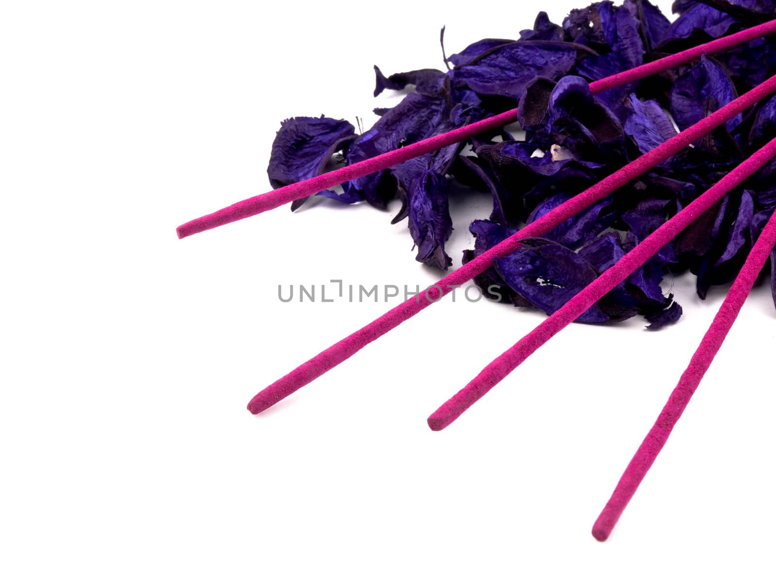 Aromatic purple potpourri and pink incenses on white background