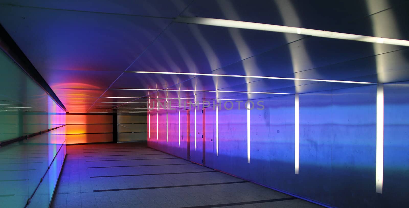 multiple colored subway corridor with neon lights