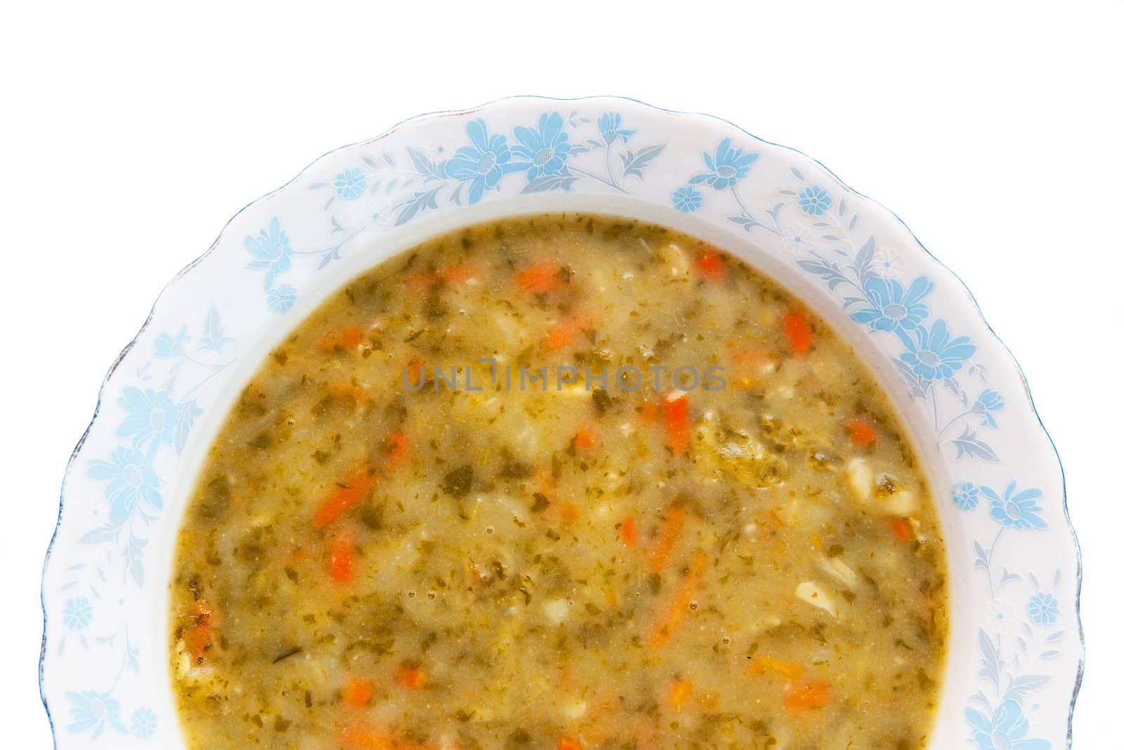Vegetable soup isolated on white
