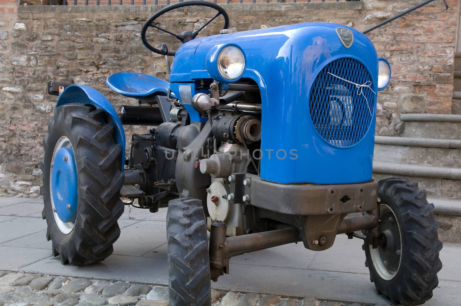 Old model of tractor; renovated to be in superb condition