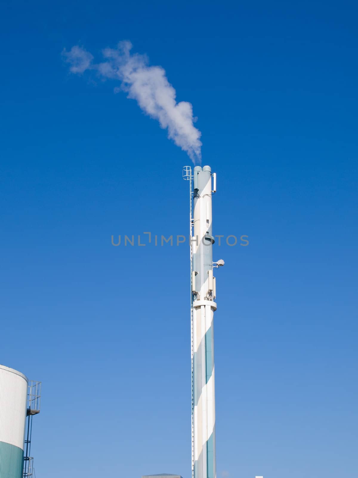 Factory plant building with a chimney modern industry background vertical