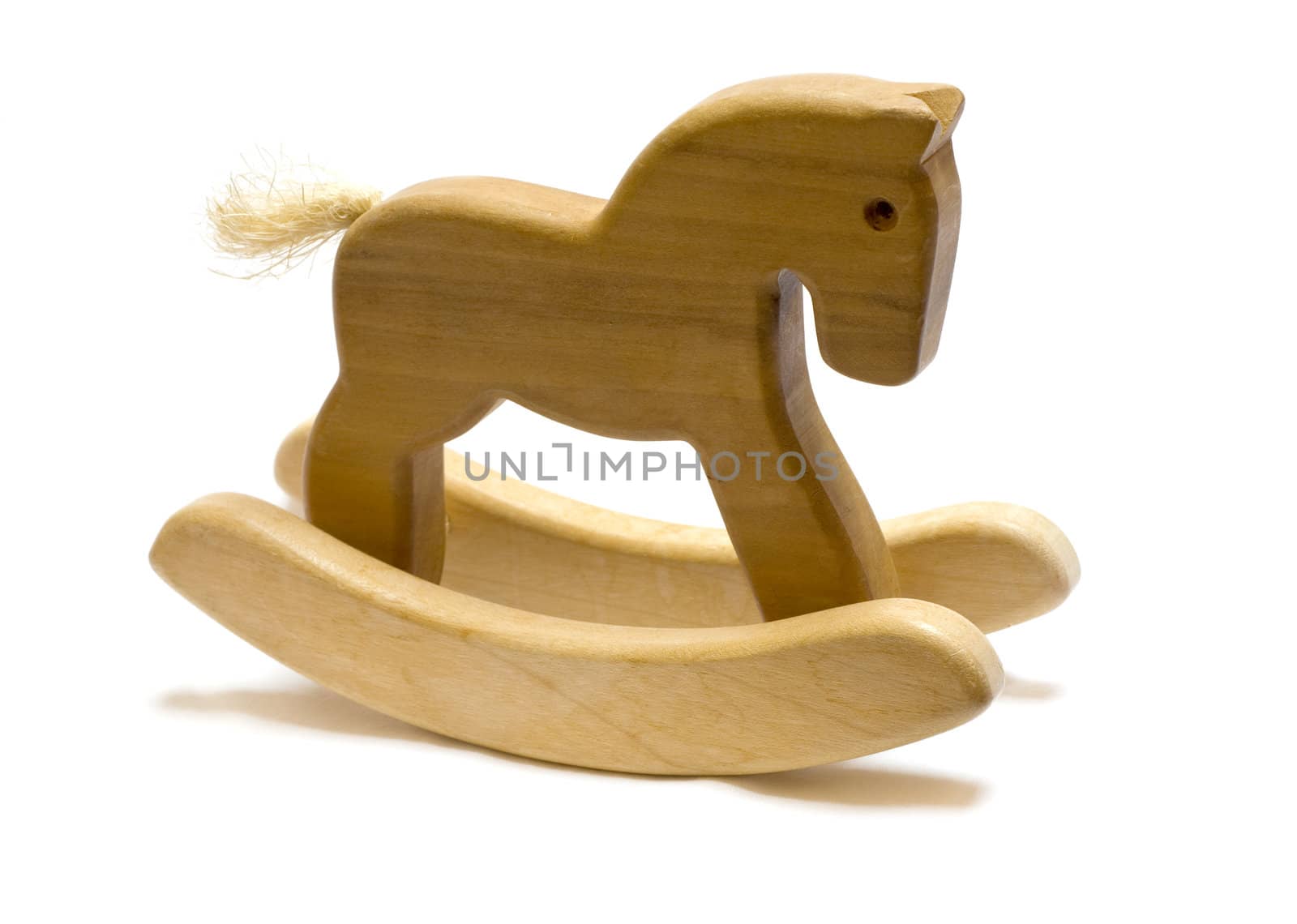 Classic homemade wooden rocking horse on white background.
