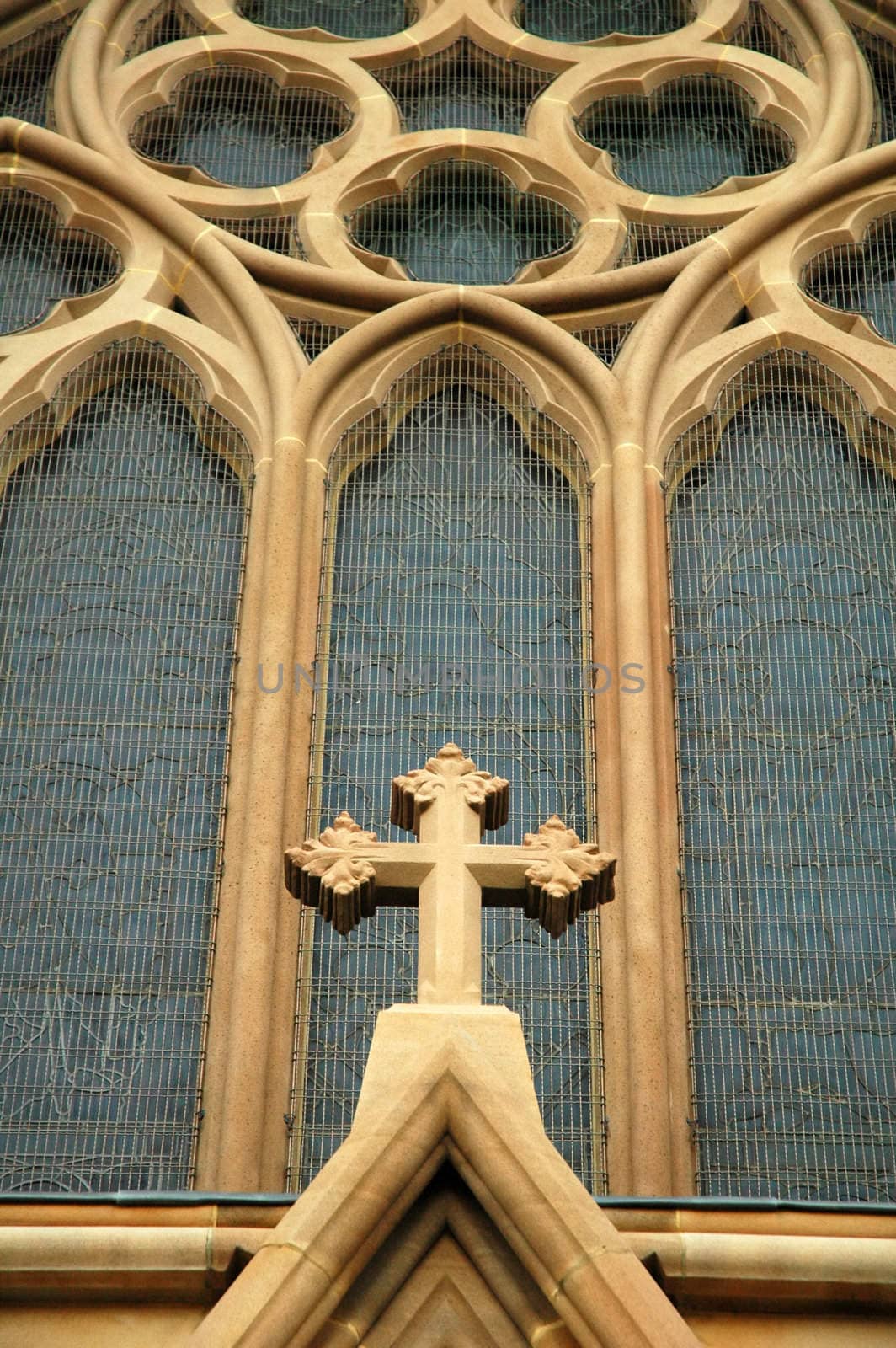 church detail, brown cross and blue windows