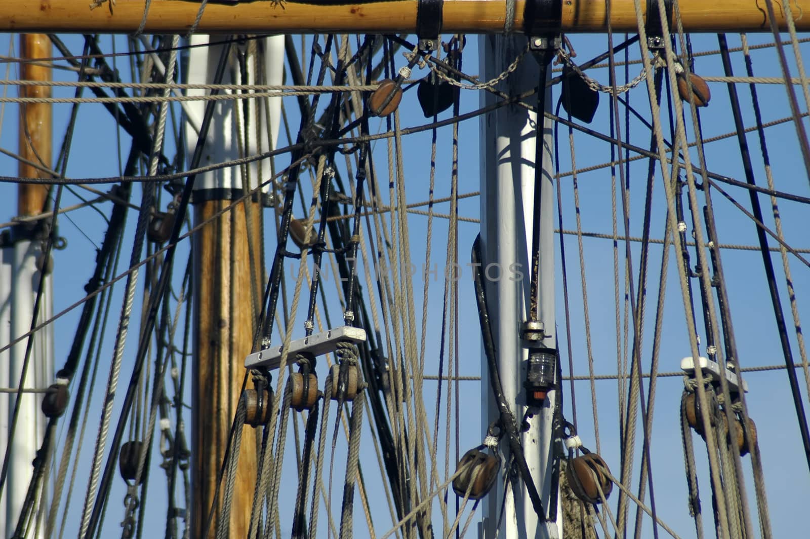 ship mast detail photo, several ropes and blocks/rollers