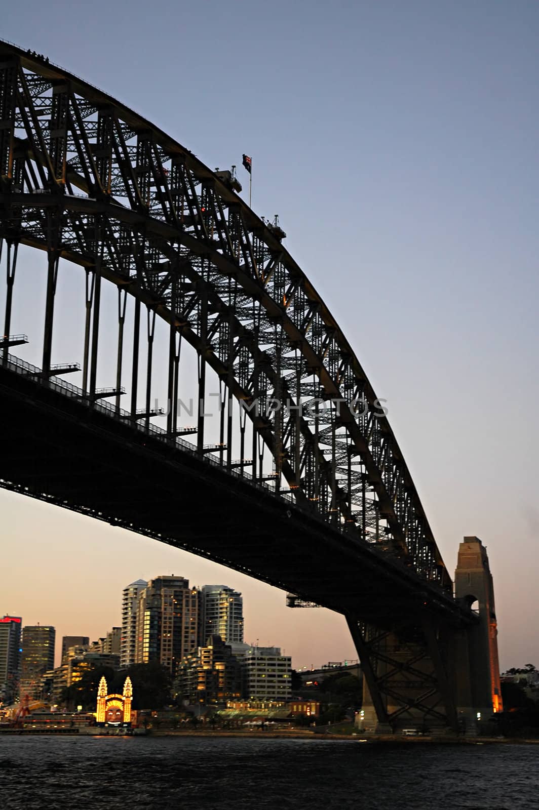 dusk photo of Harbour Bridge; location: The Rocks, Sydney; circus in background