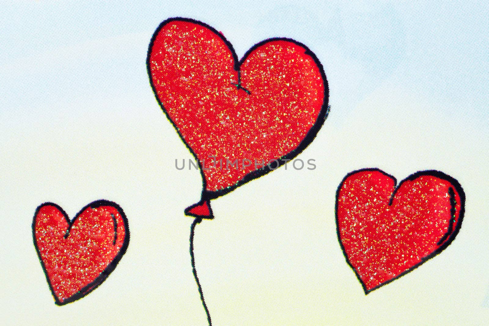 Three red baloon hearts on colorful background

