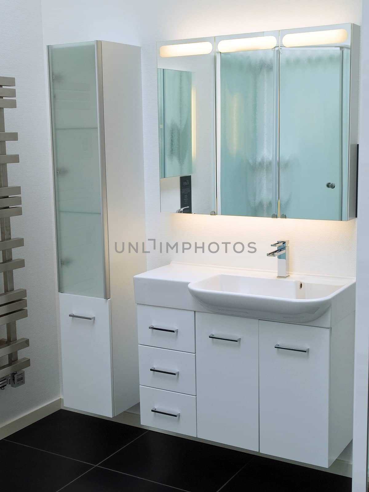 Details of a modern trendy contemporary designer bathroom in all white elements