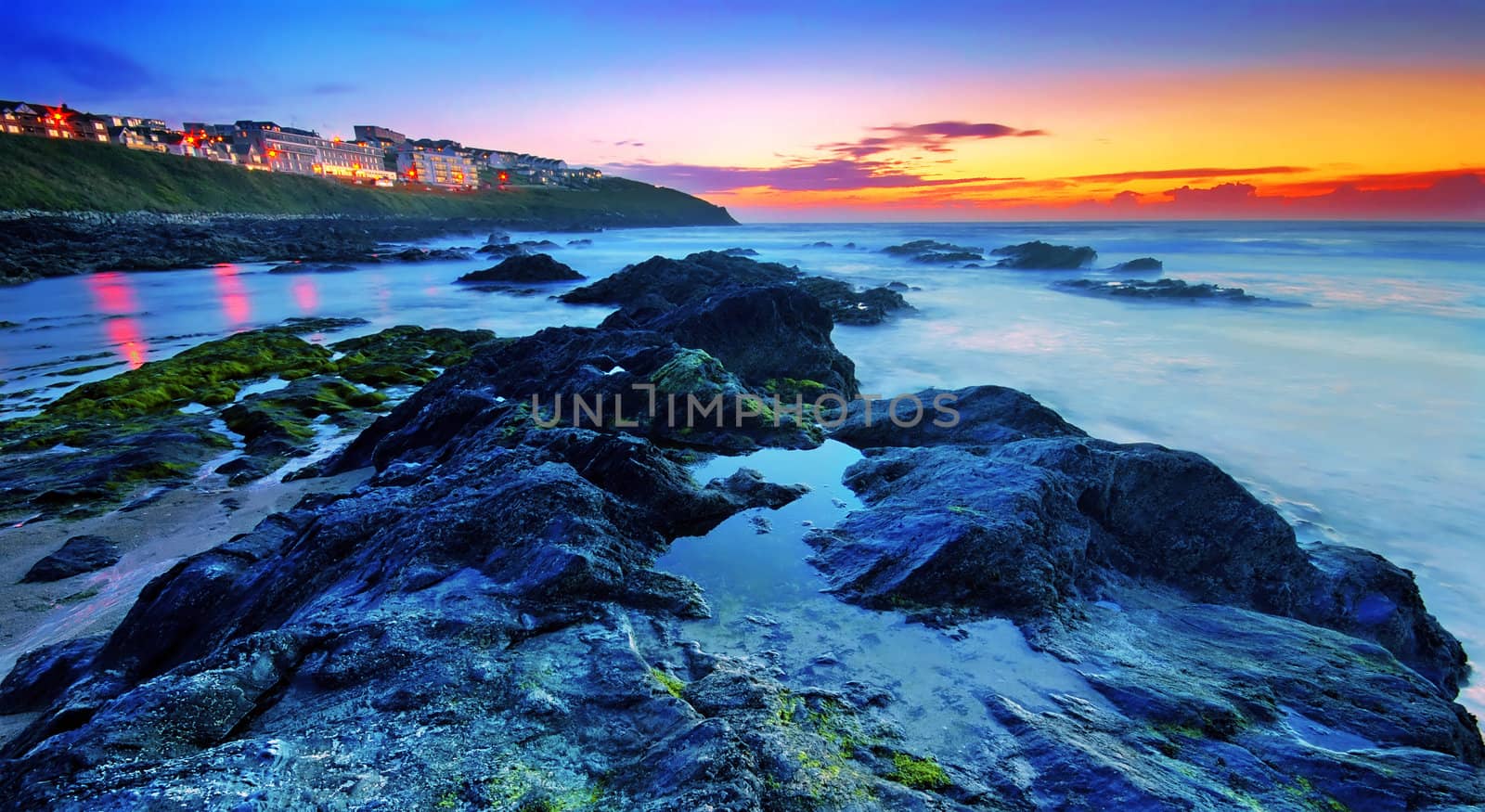 Sunset by the ocean in Newquay, Cornwall, UK 
