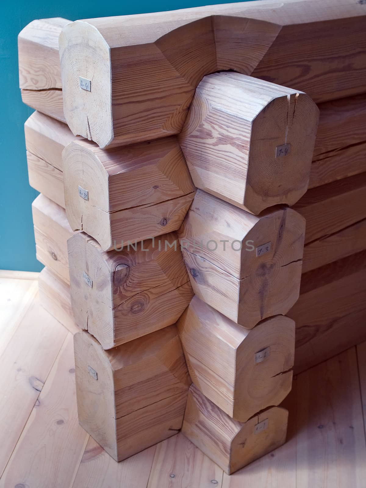 Details of a corner of a house made with heavy wood logs