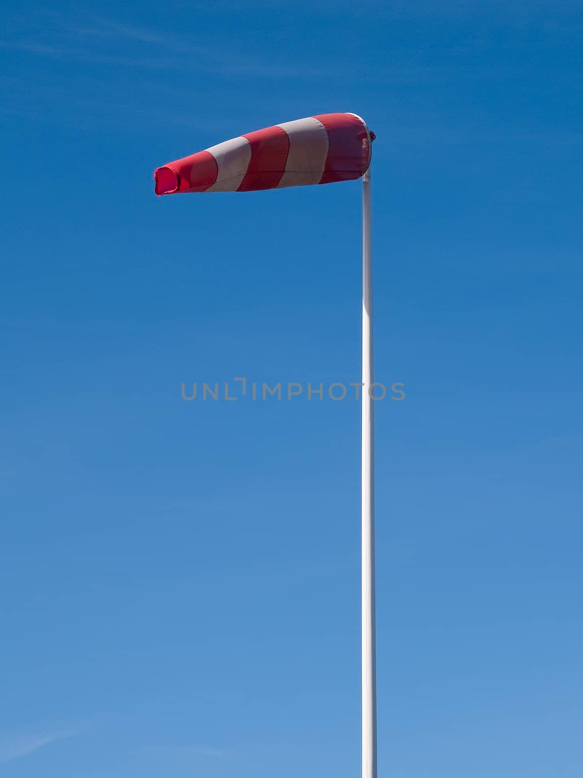 Airport windsock - vertical image by Ronyzmbow