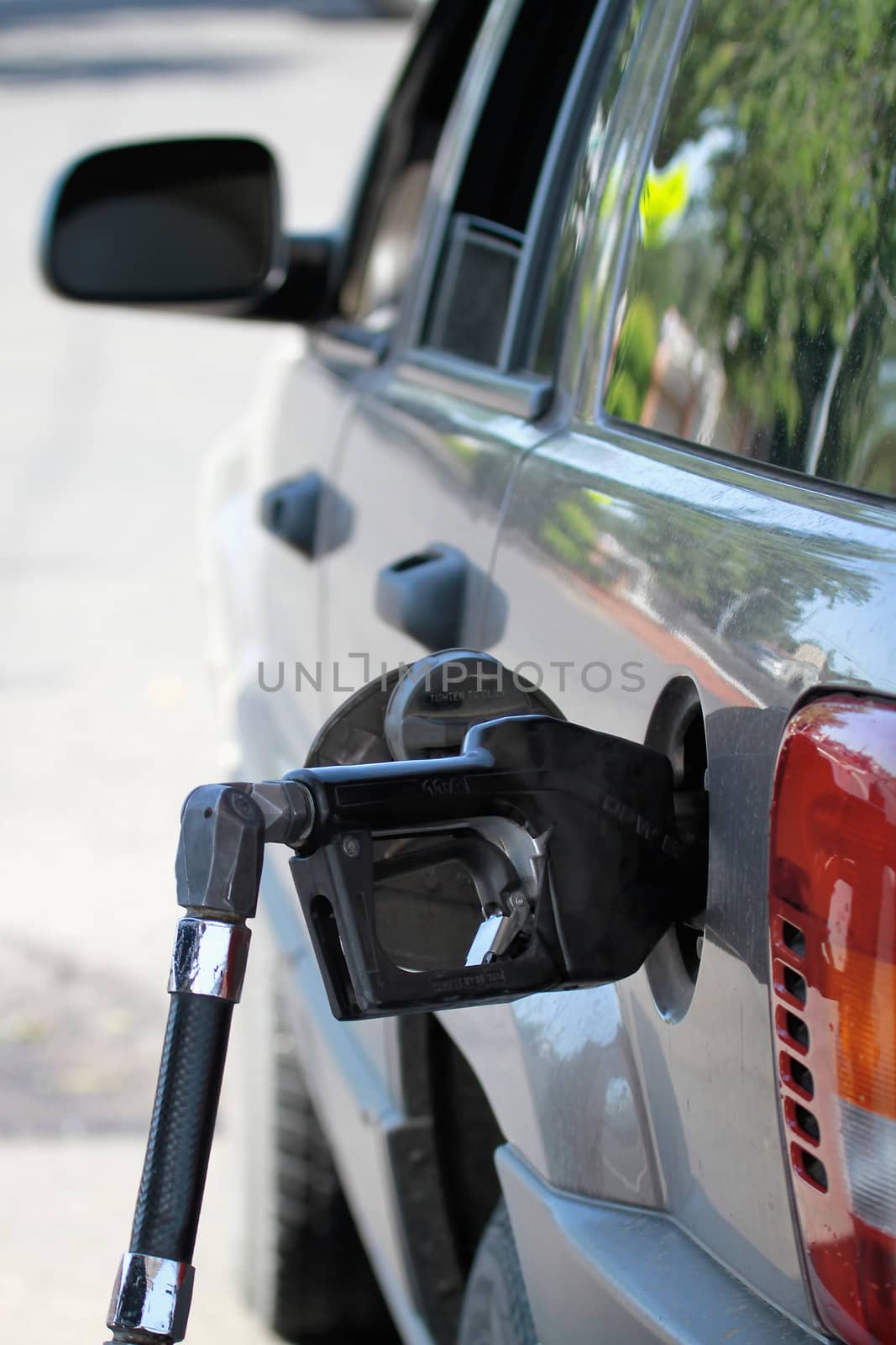 Pump Filling Up the Car at the Gas Station