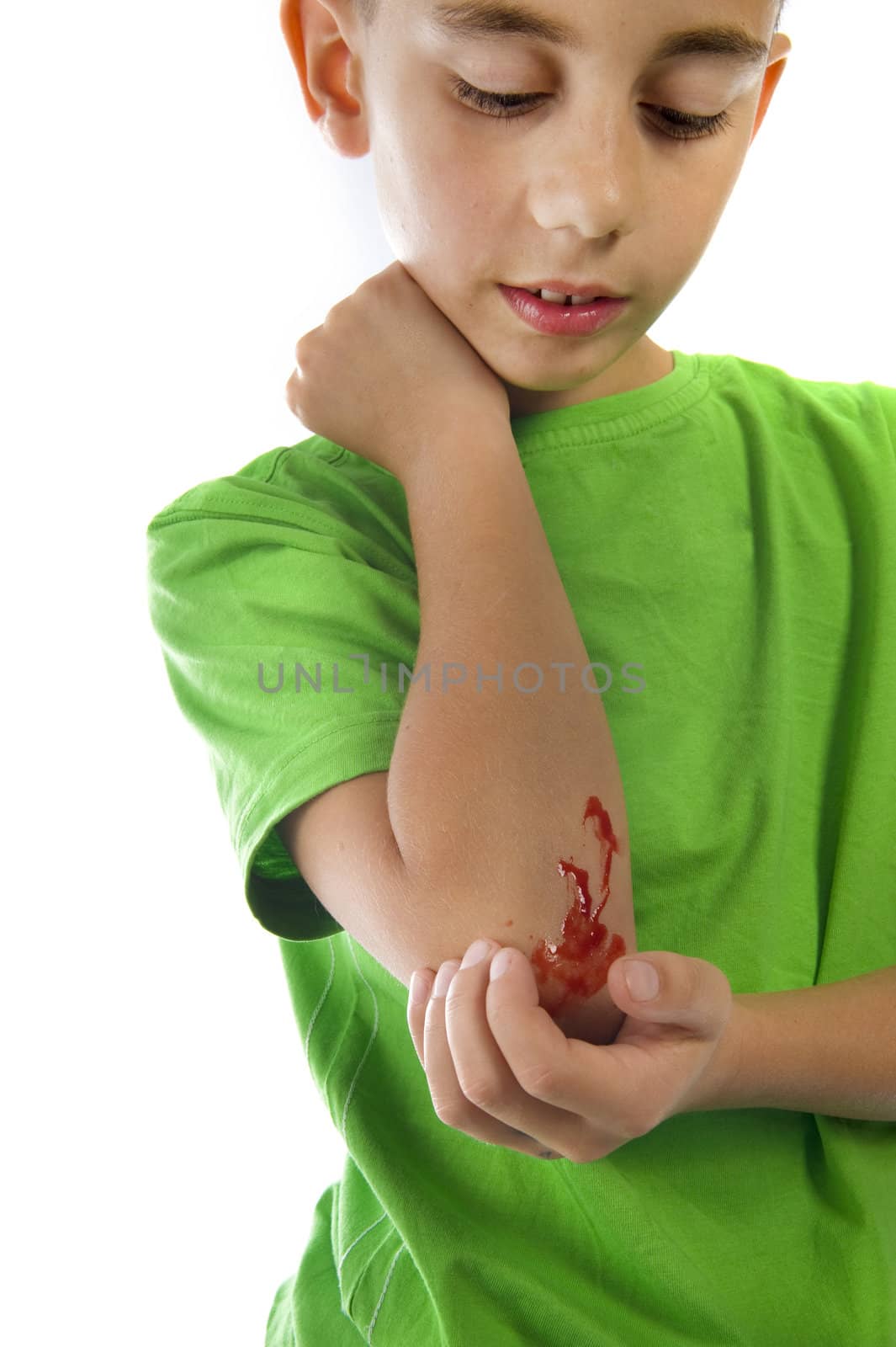 a young boy with a painful elbow on white