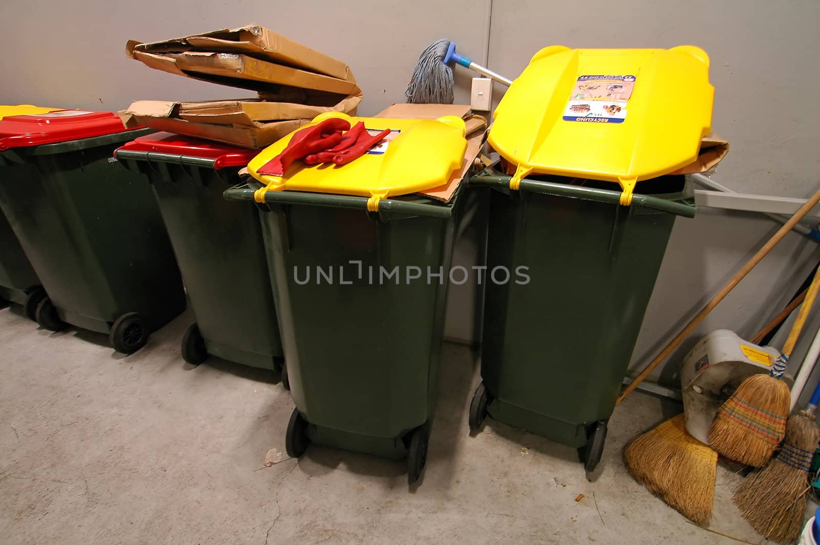 garbage room, yellow and red bins; wide angle shot