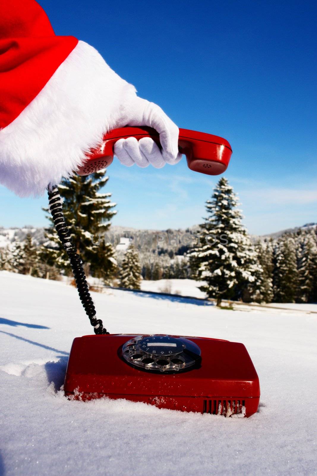 Santa Claus Hotline symbolized by a red retro phone...