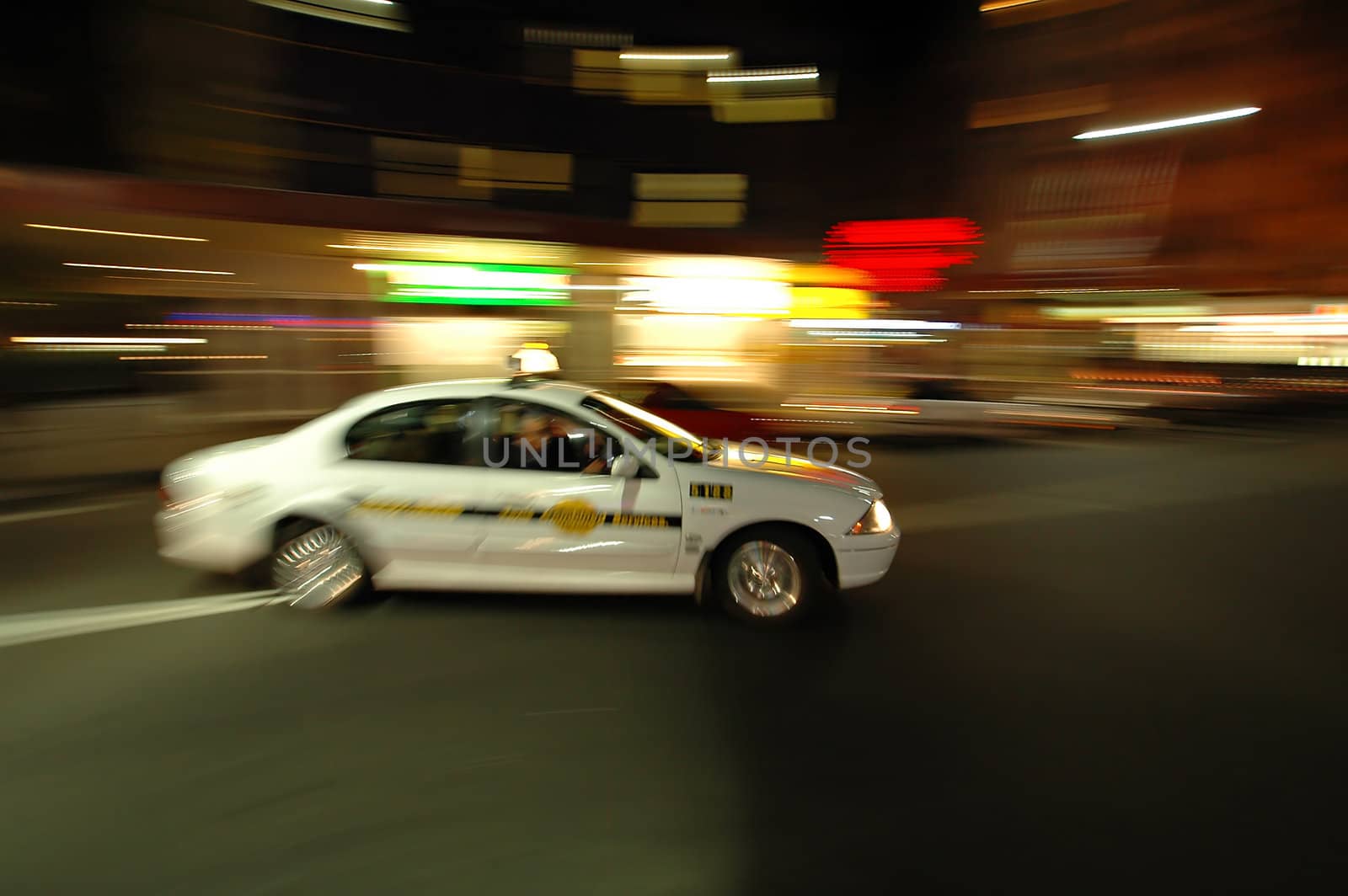 blurred picture of Sydney taxi taking a corner ..
