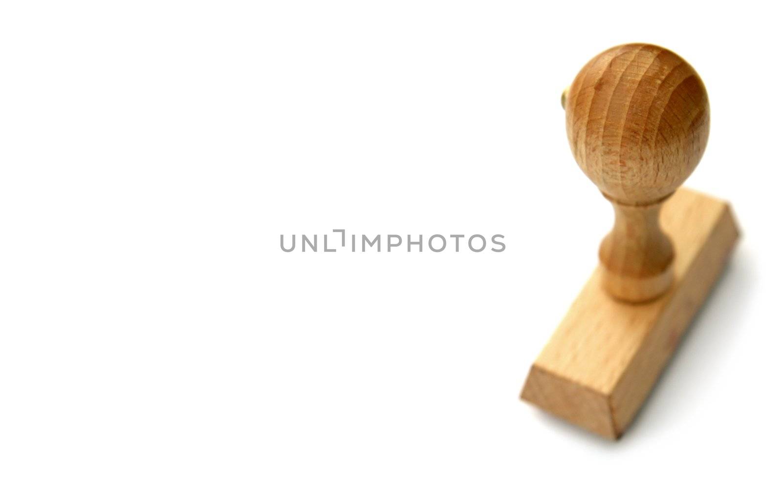 wooden stamp on clear white background, distance blur